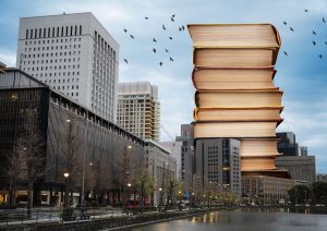 giant-stack-books-urban-environment-min-300x212 NEWS AND ARTICLES